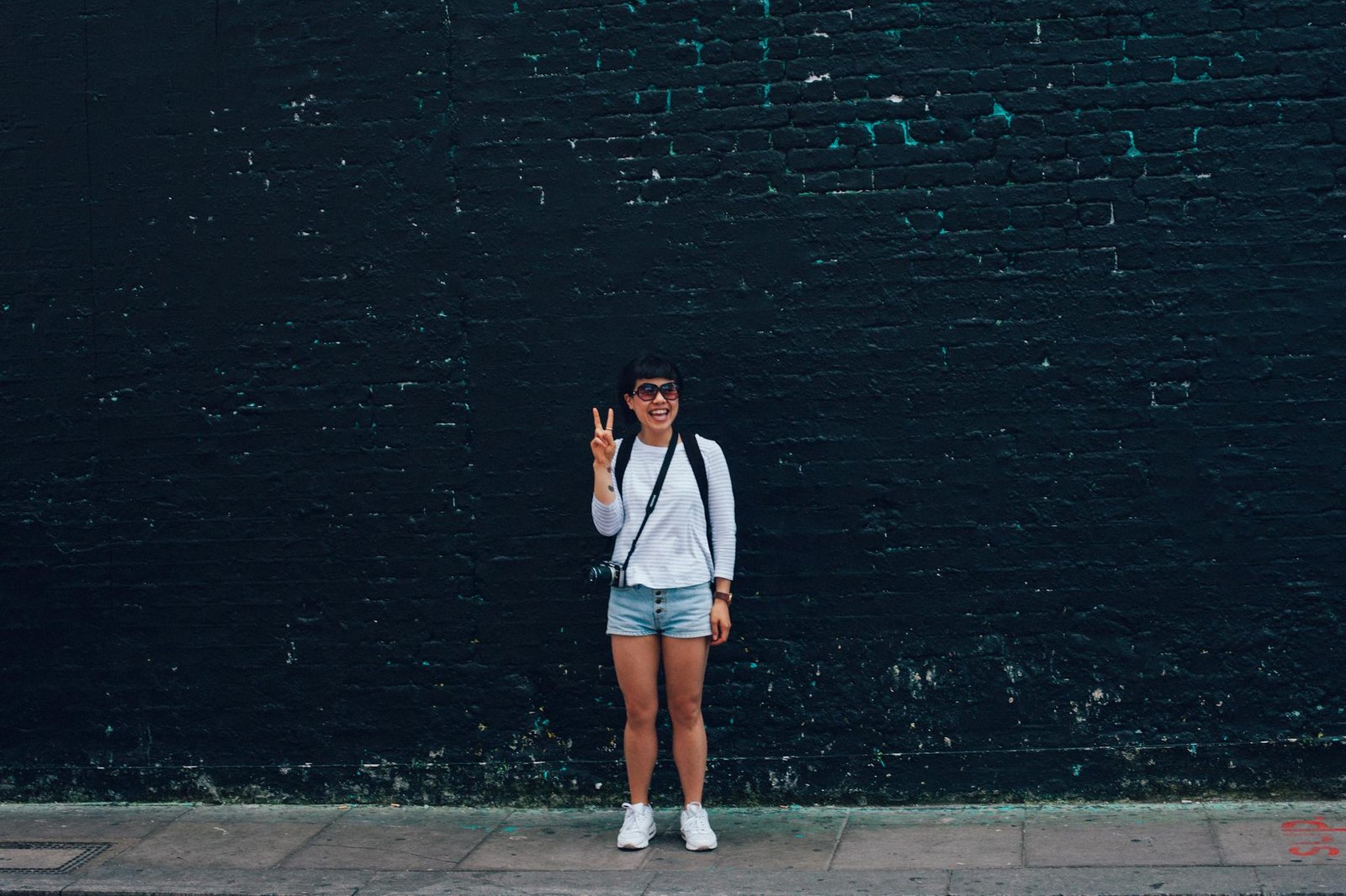 Smiling Woman In Sunglasses Posing With A
